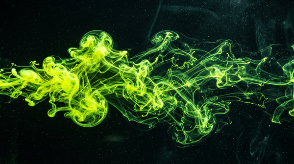 Brilliant fluorescent yellow-green fluorescein dye plume dispersing through clear water