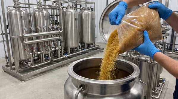 Ion exchange resin beads poured into an industrial water treatment vessel