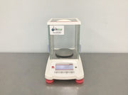 Ohaus Pioneer analytical balance with glass draft-shield enclosure on clean white bg, from Lab World Group WooCommerce C